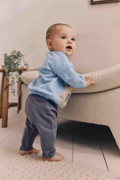 Light blue baby sweatshirt featuring teddy bear applique on the chest