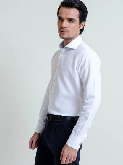 Men's white cotton dress shirt, long sleeve button front with gold buttons, profile