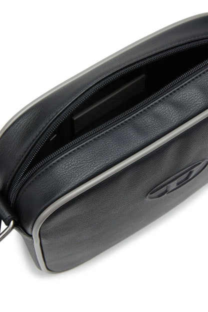 Diesel black bag with black zipper, open top seam, and dark lining