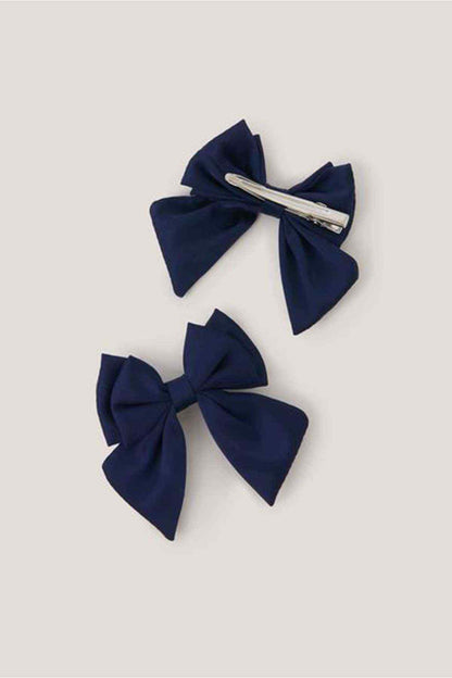 Navy fabric bow hair clip with visible pin backing, two bows