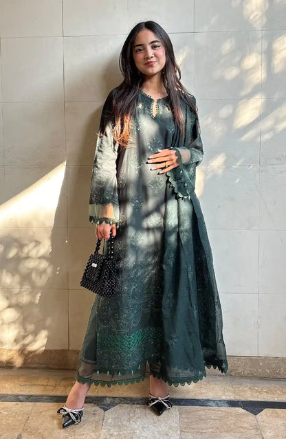 Bottle green long embroidered kurta with open neckline and sheer sleeves, side pose