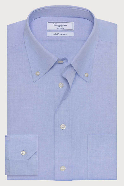 Light blue dress shirt with spread collar, button placket, and chest pocket