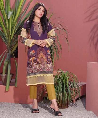 Women’s long embroidered tunic dress with gold trim, patterned front and cuffs