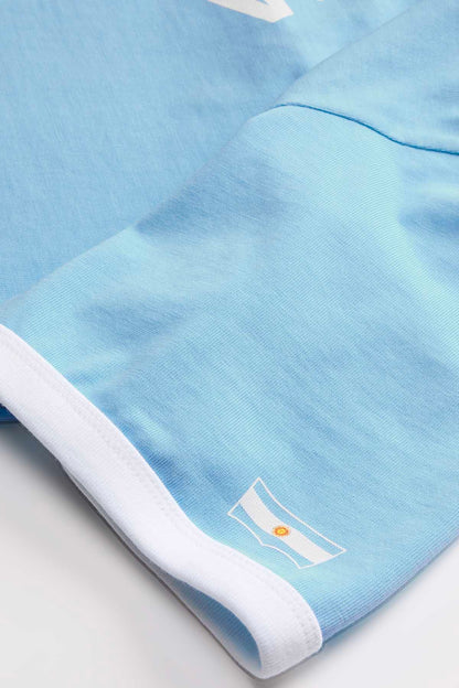 Sky blue T-shirt hem and cuff detail with white trim and small logo print