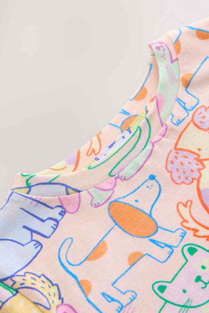 Kids multicolor cartoon animal T-shirt fabric close-up on sleeve