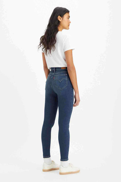 Levi's dark indigo denim skinny jeans, curved back yoke stitching