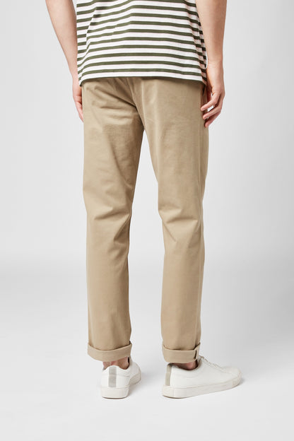 NEXT natural chino trousers on model, relaxed tapered leg, ankle length