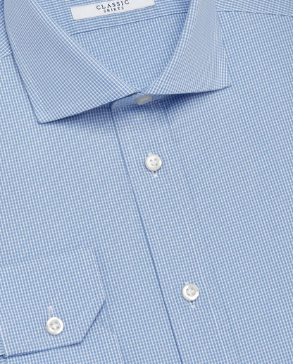Light blue check dress shirt close-up with pointed collar and white buttons