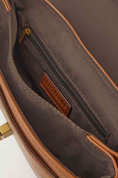 Tan bag interior with zip pocket and dark fabric lining
