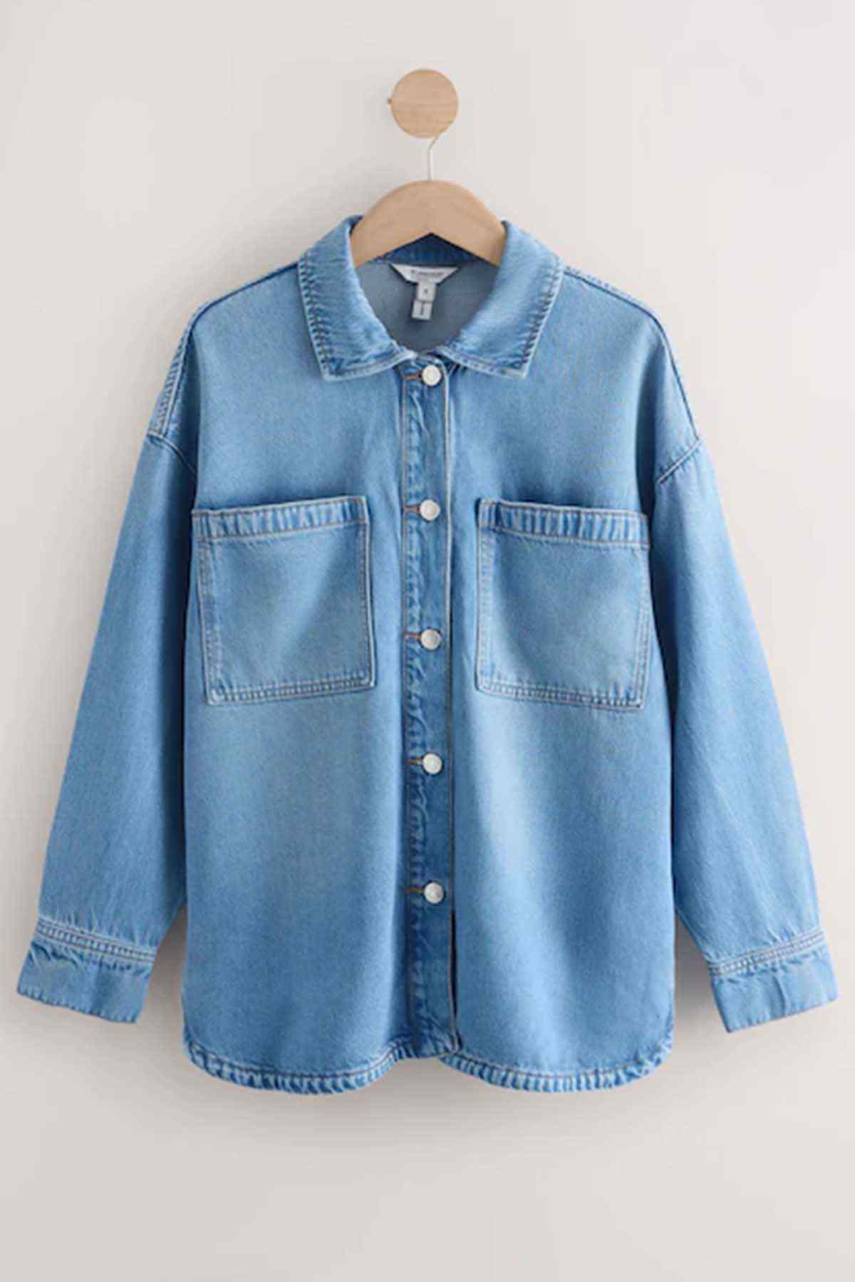 Next mid blue denim jacket front view with button closure and two chest pockets