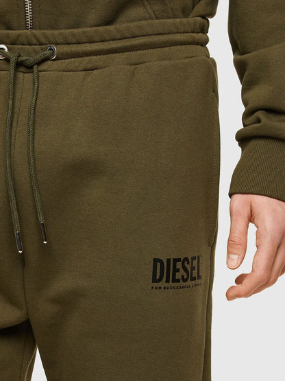 Men's green jogger pants with drawstring waist and Diesel logo patch