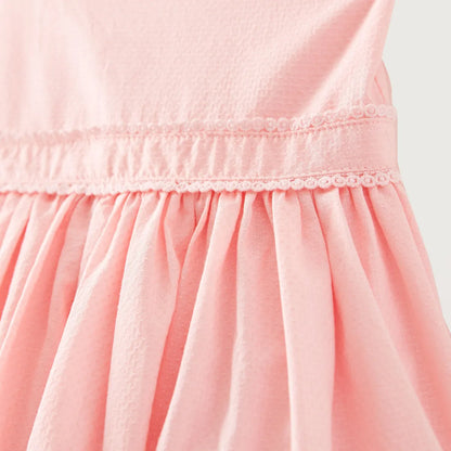 Pink dress bodice with smocked waistband and gathered pleated skirt detail