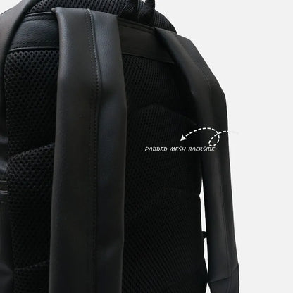 Back panel of black backpack with padded mesh section and vertical strap padding