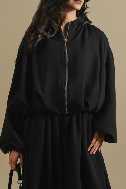 Black zip-front blouse dress with balloon sleeves and elastic waist