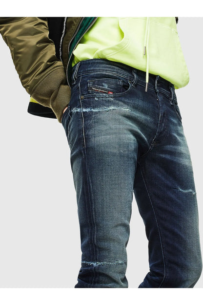 Diesel indigo denim jeans with back-pocket detail, worn wash and stitched seams