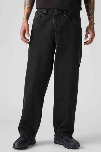 Black denim jeans with belt loops and five-pocket styling