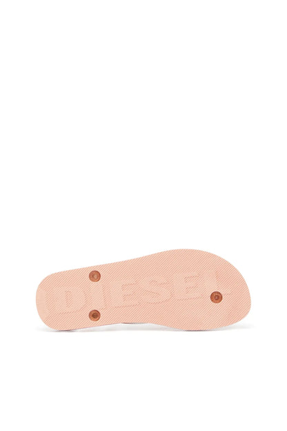 Diesel copper-toned flip-flops outsole with traction tread and round studs.