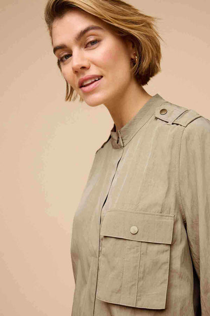 Khaki green buttoned utility jacket with flap chest pocket and shoulder tabs