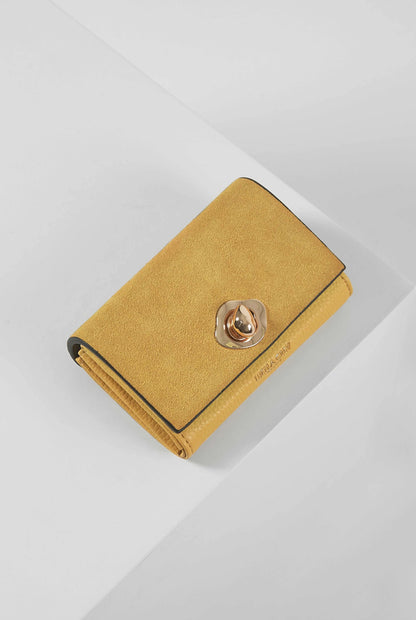 Yellow suede wallet with round metal snap and fold-over flap