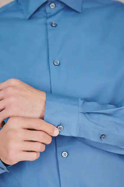 Blue dress shirt cuff and button placket detail