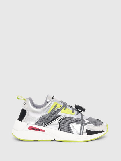 White and gray Diesel sneakers with neon yellow accents and black strap detail
