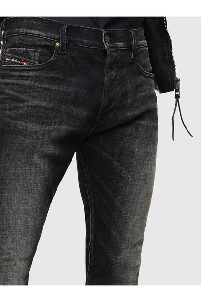 Slim black jeans close-up of front pockets and coin pocket stitching