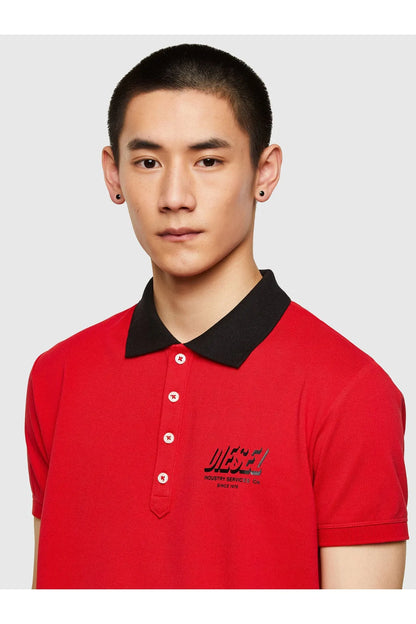 Diesel red polo shirt close-up with black collar, white buttons, front chest logo