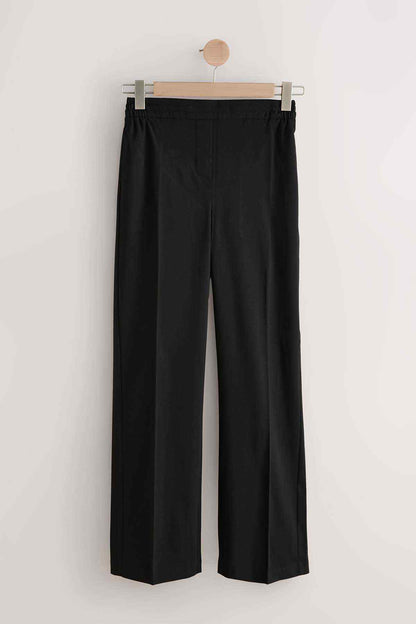Black wide-leg pants on hanger with center pleats
