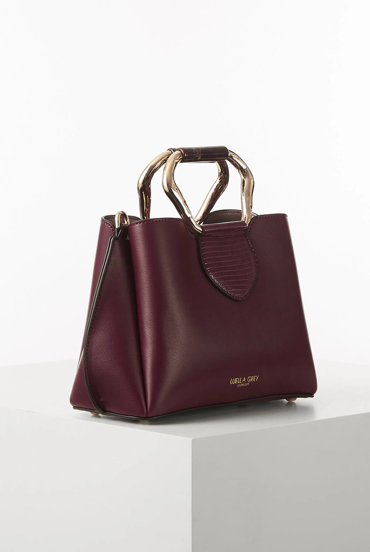 Berry structured handbag with dual top handles and shoulder strap