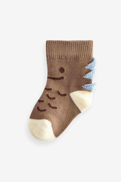 Single kids' crew sock in brown with smiling face and dot detail