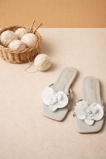 Slide sandals with flower embellishments and pearl centers