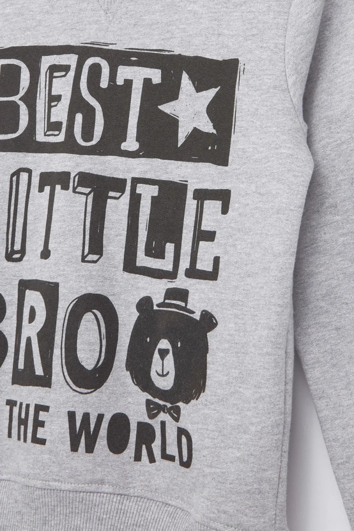 Kids grey hoodie close-up: black “Best Little Bro in the World” graphic