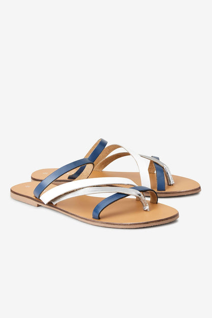 Navy and white thong sandals, side view, flat straps with metal buckle
