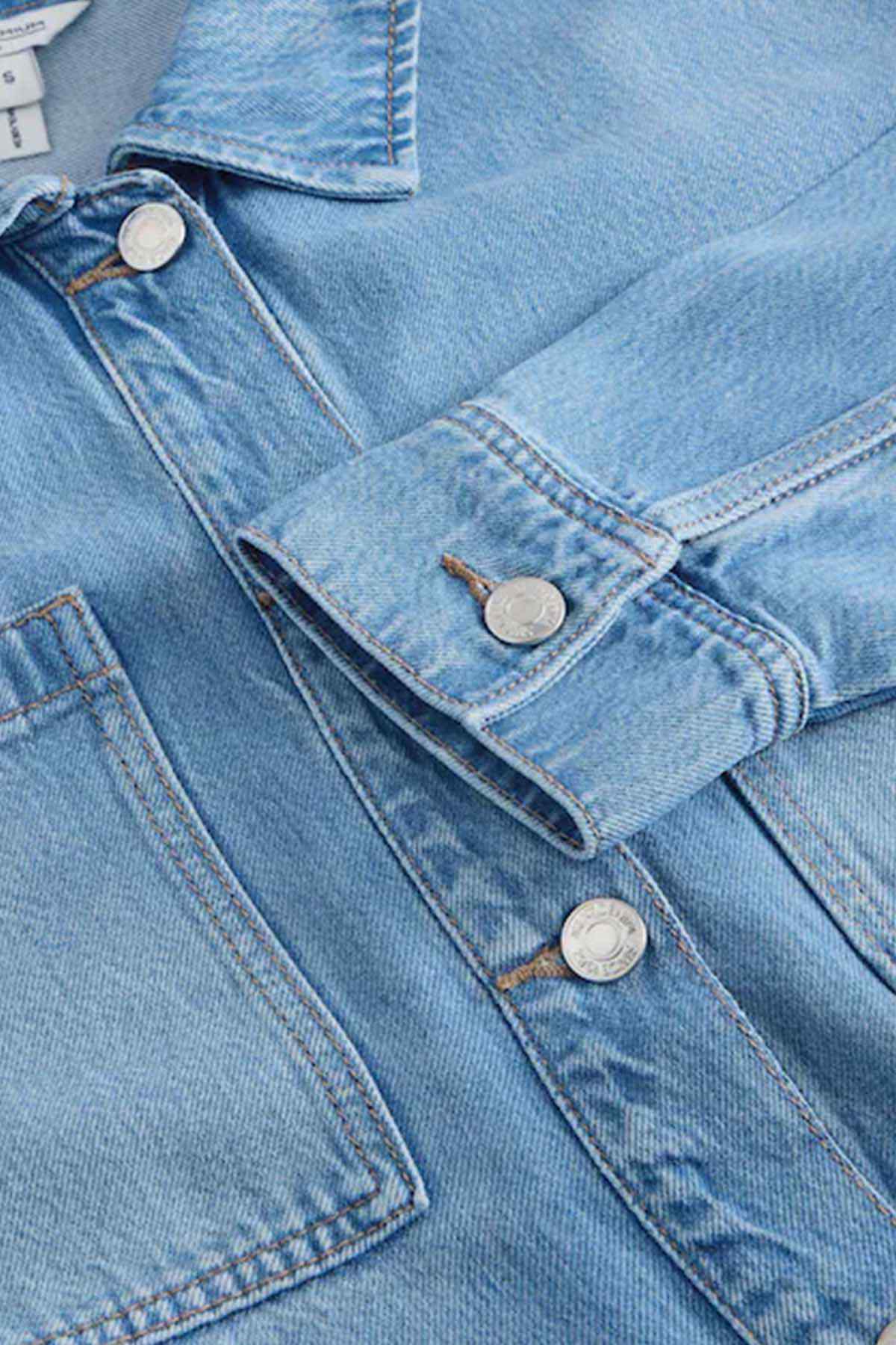 Next mid blue denim jacket sleeve cuff with button and metal snaps