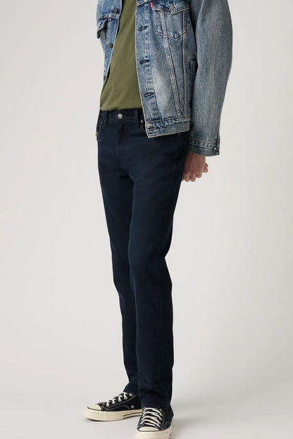 Levi's blue denim jeans detail view, dark wash straight legs with cuffed hem