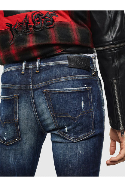 Diesel indigo denim jeans with Diesel logo patch, back yoke, and pocket seams