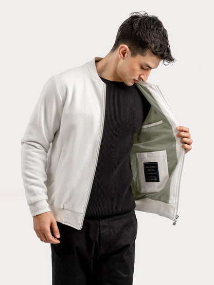 Vanilla bomber jacket open to show inner lining and front zipper