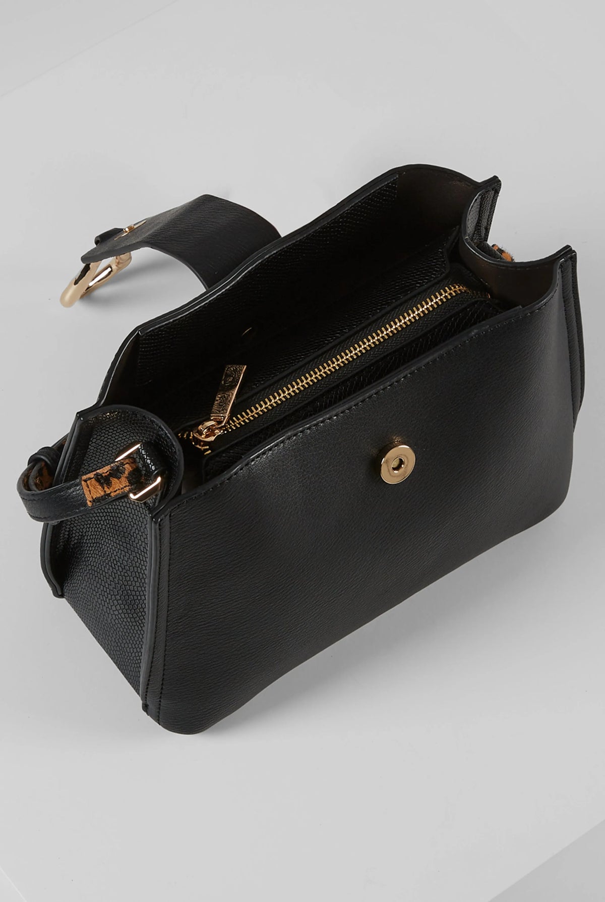 Black leather-look handbag with gold zipper and front hardware accent