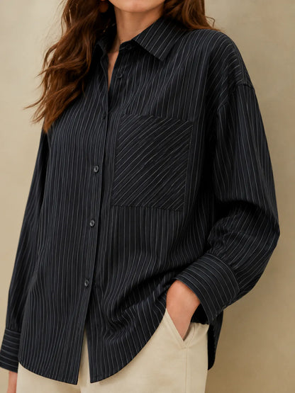 Black pinstriped button-up shirt with chest pocket detail, long sleeves, collar