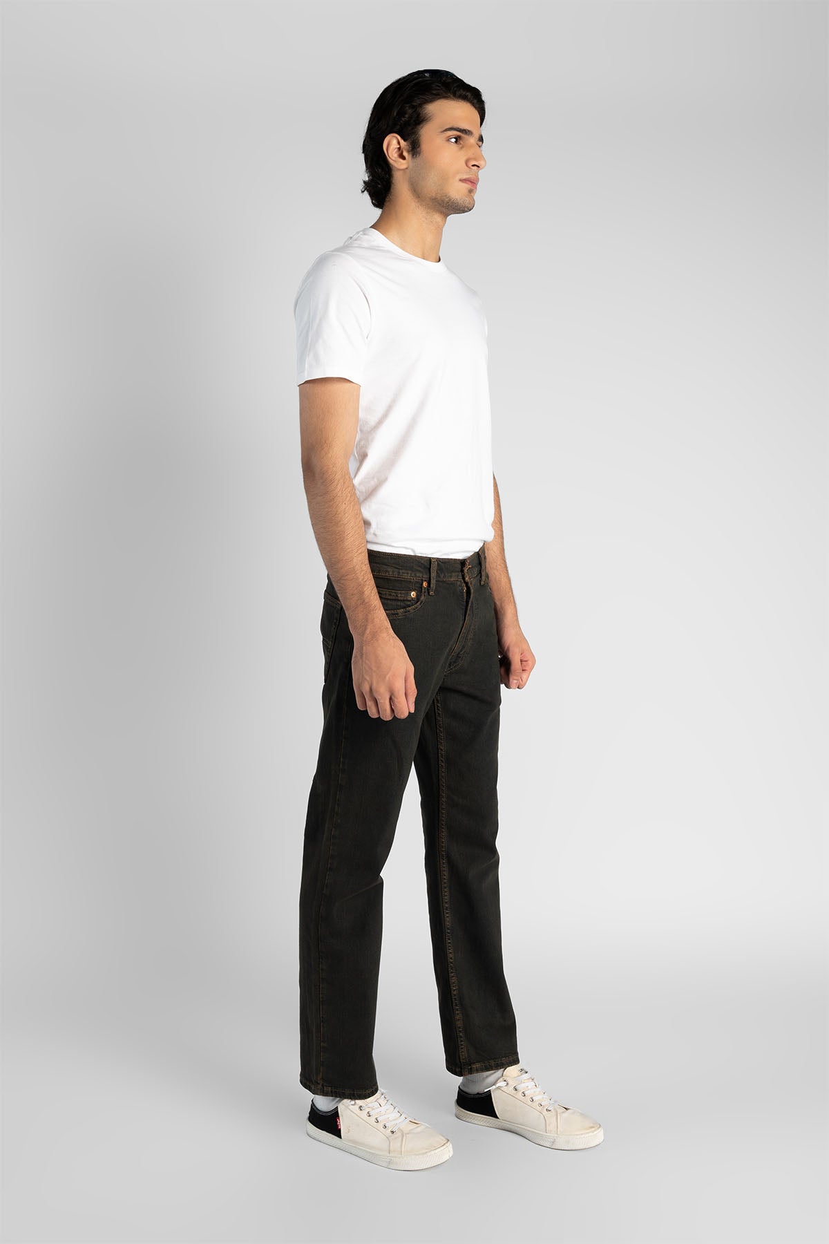 Levi's dark denim jeans with straight leg, side view