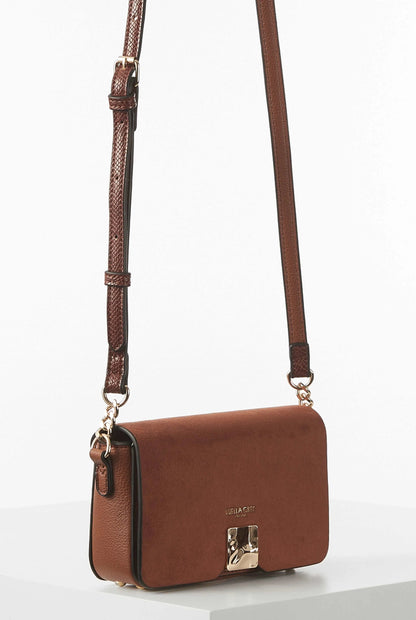 Brown flap crossbody bag with front clasp and long adjustable strap