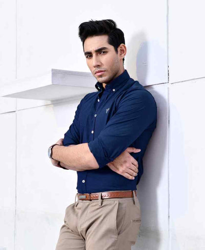Blue fitted button-up shirt with collar, long sleeves, and button placket