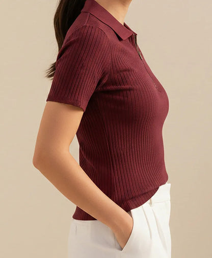 Fitted maroon short-sleeve ribbed knit polo shirt with side profile and half-zip detail