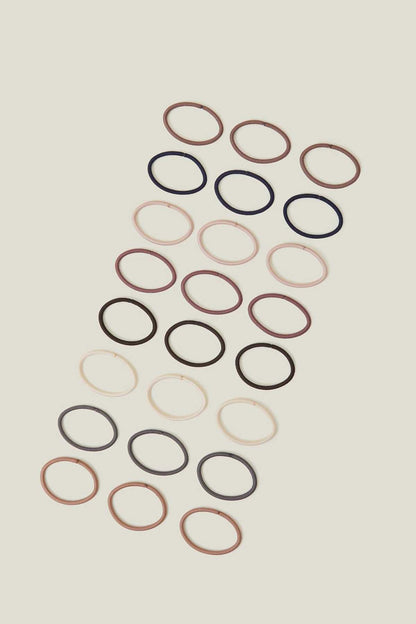 Set of pastel hair elastics in mixed colors, oval loop bands arranged in rows