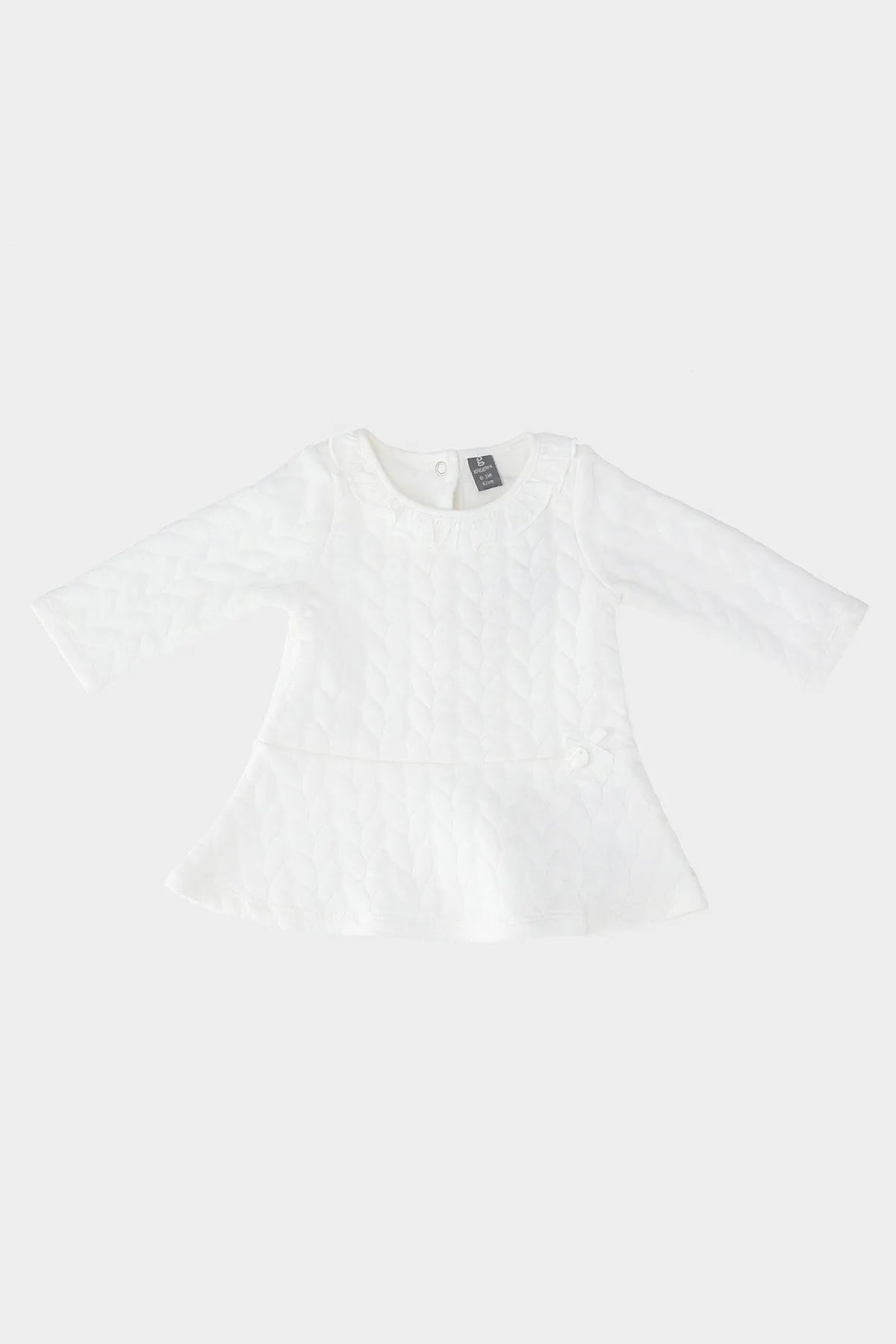 Cream baby dress with textured pattern, long sleeves and flared peplum hem
