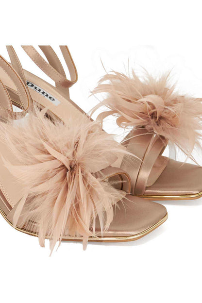 Mink feather-strap heeled sandals close-up with knotted feather detail