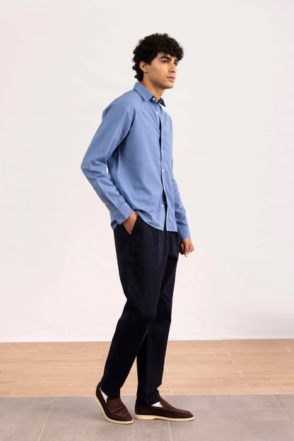 Men's blue long-sleeve button-up shirt with button placket and chest pocket