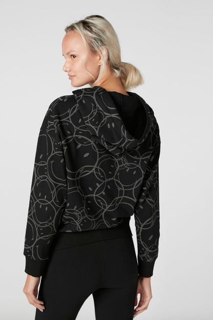 Black patterned hoodie with drawstring hood and long sleeves, side view