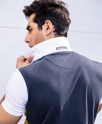 Back of men's polo sweater vest with 'FITTED' text and yellow side panel