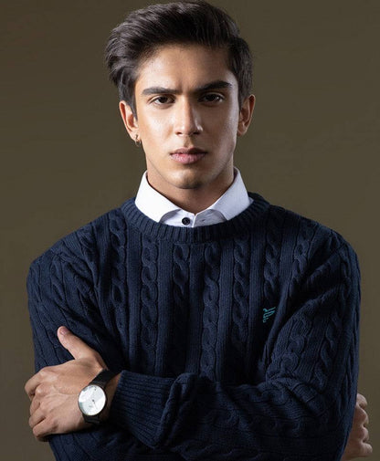 Navy cable-knit fitted sweater with textured cable pattern and long sleeves